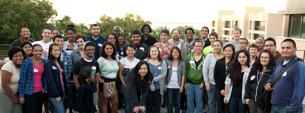 Office of Undergraduate Recruitment and Retention program students and staff stand together.