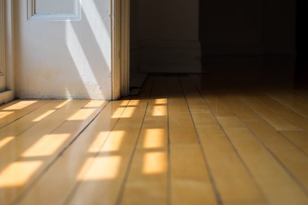 Floor boards with light shining on it