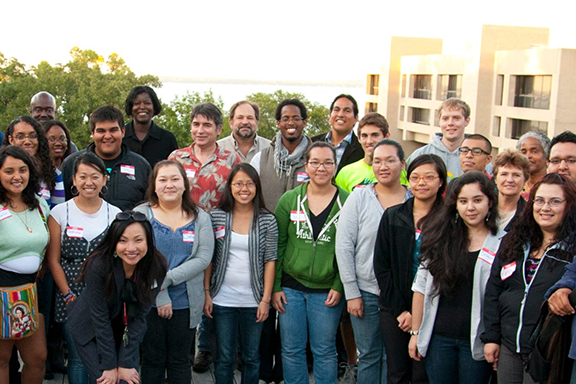 Office of Undergraduate Recruitment and Retention program students and staff stand together.