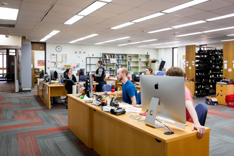 Merit library staff working at their computers