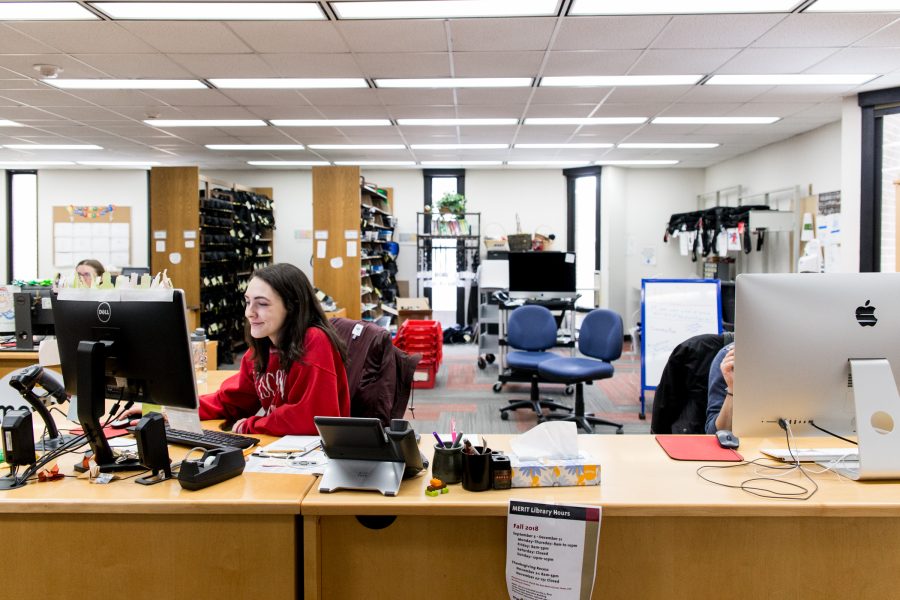 Individual working at the MERIT library front desk