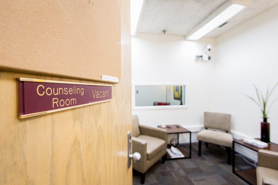 Door with sign "Counseling Room" open ajar.