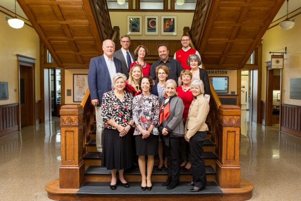 School of Education Board of Visitors standing in stairway.