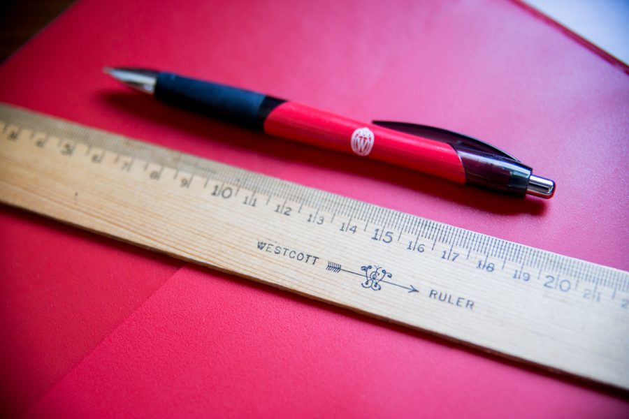 Image of a ballpoint pen with Wisconsin crest and Westcott ruler.