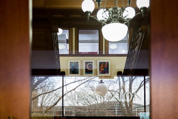 reflection in the front door of the uw school of education building