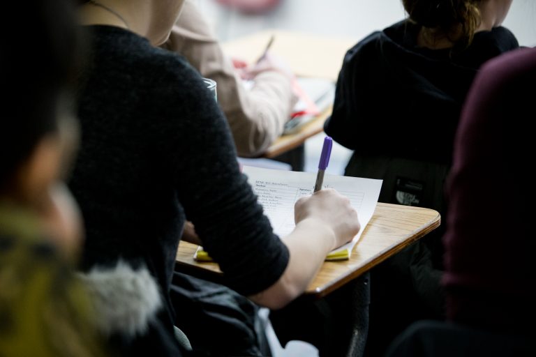 Student taking notes