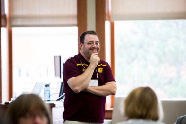 Engaged speaker at Literacy conference.
