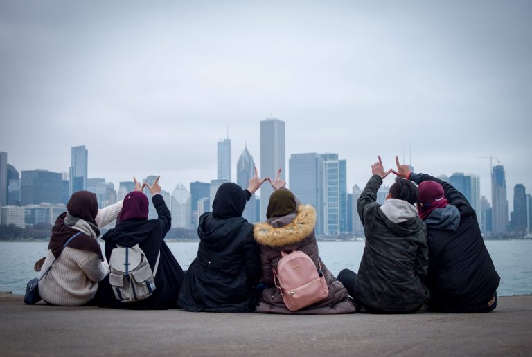 Badgers holding up a "W" in Chicago.